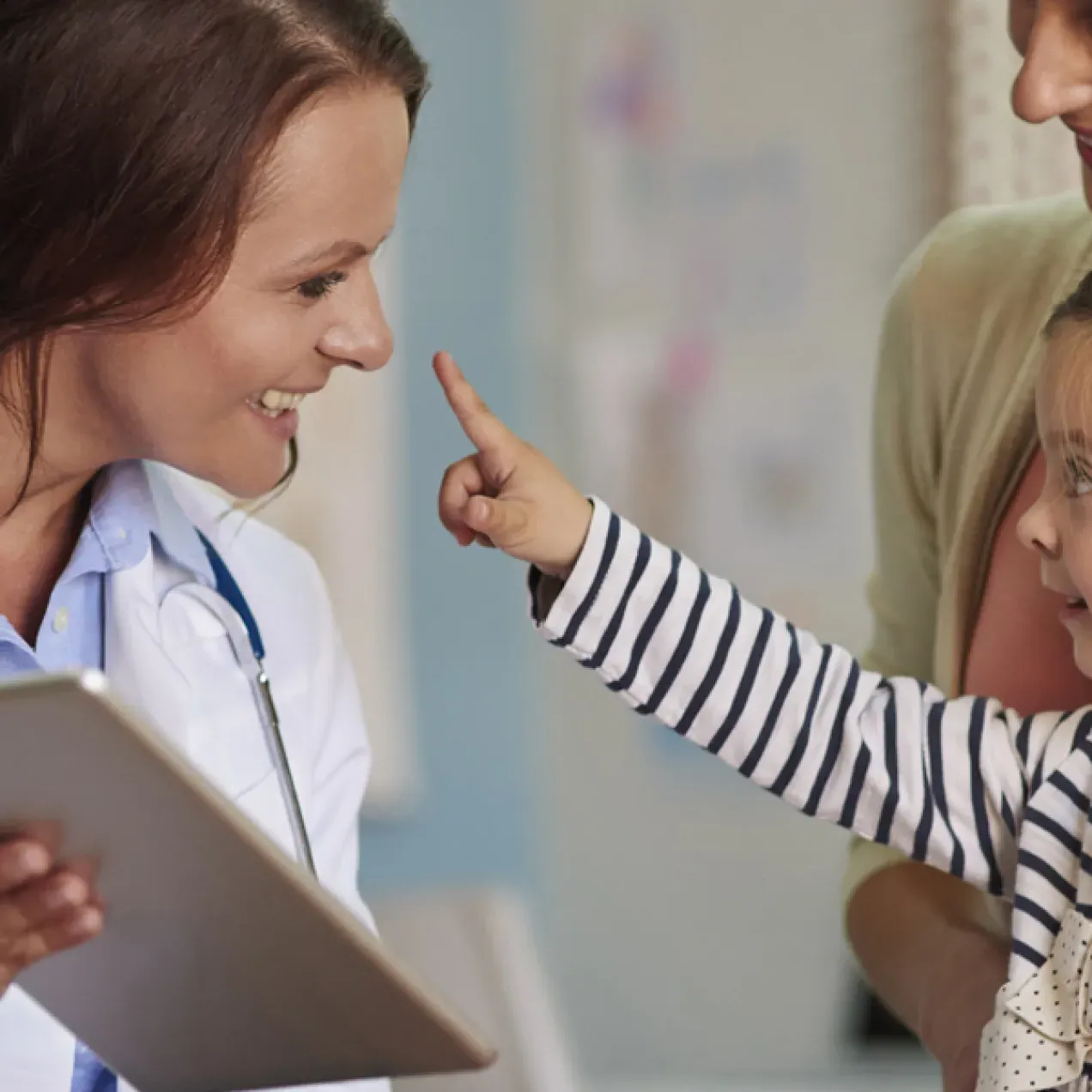 Nurse Practitioner Smiling with Pediatric Patient